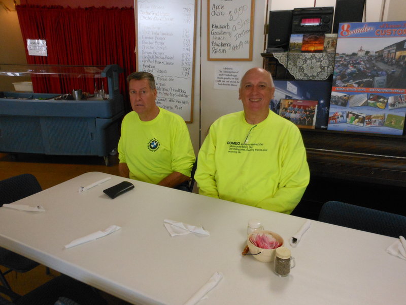 This last table didn't stay mostly empty for long.  In fact, they had to set up a couple more tables in the little general store next door to accommodate the overflow. So even these guys got someone to sit with them.