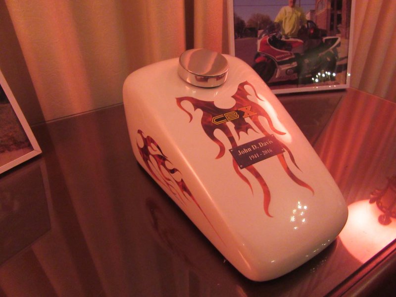 This funeral urn was created especially for John.  His brother explained that the graphics were obtained with special permission from Honda and brought from California.