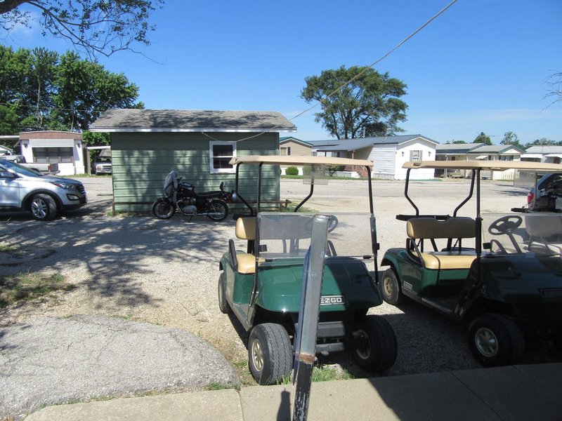 Larry #2 got that BMW into the shade along with golf cart only parking!