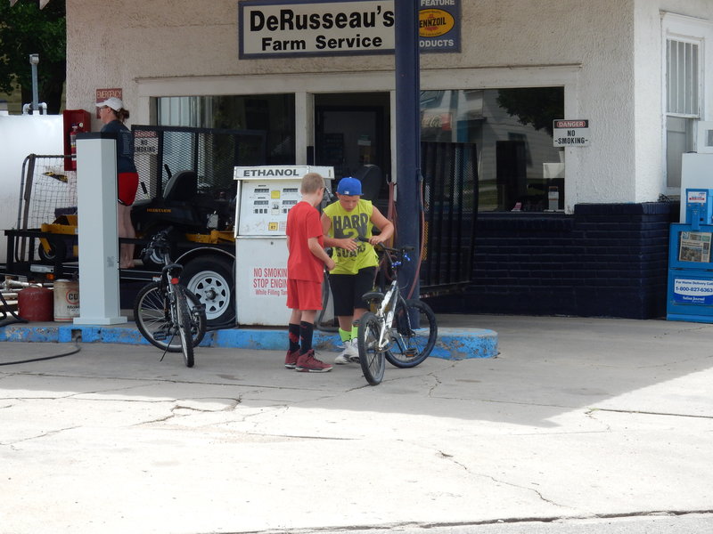 A Norman Rockwell moment &quot;Boys and Bikes at the air hose&quot;