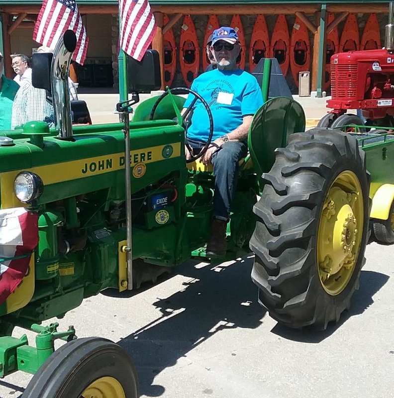 George this week on his tractor at Cabelas.jpg