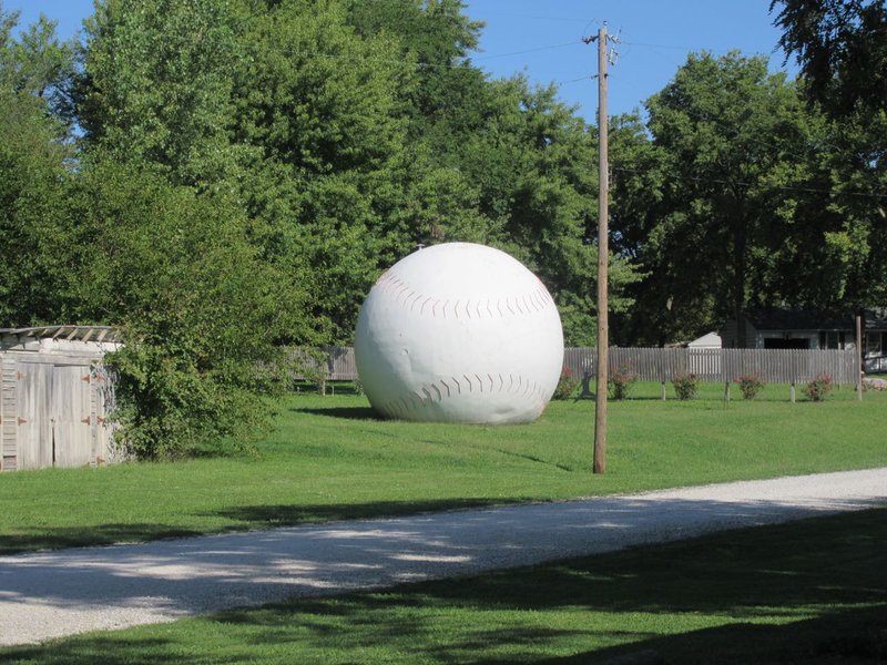 A BIG KID LEFT HIS BALL IN THE YARD.