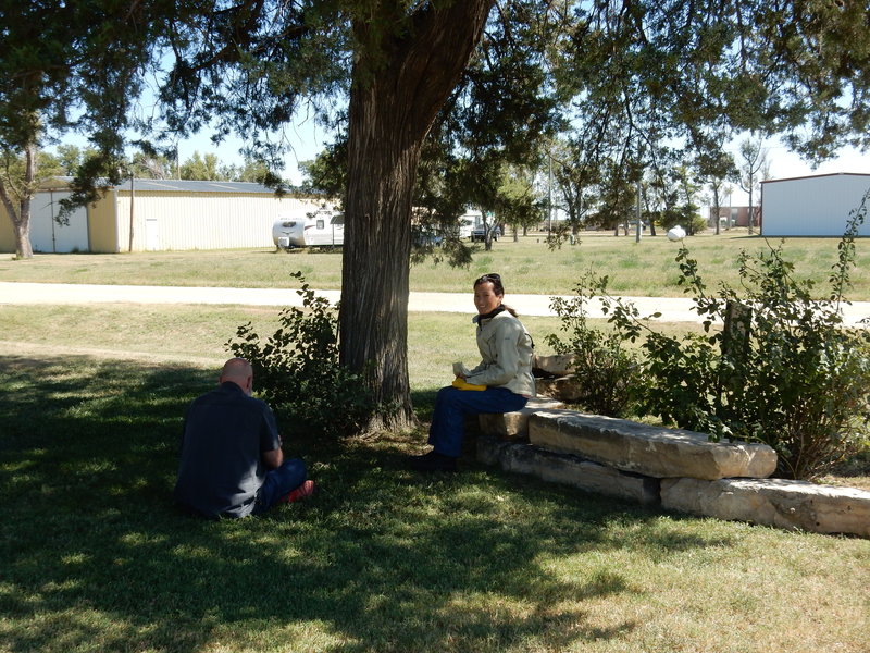 Romeo Riders enjoying the nice weather under an old cedar tree.