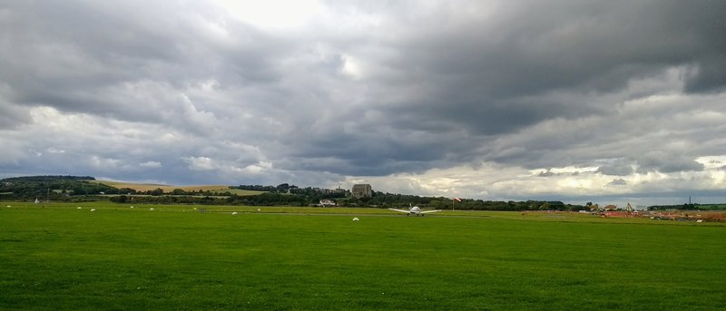 View over the airfield with the famous Lancing College in the background