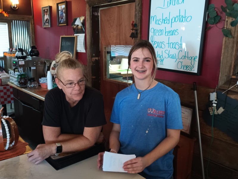 Our gracious and lovely waitress and the owner