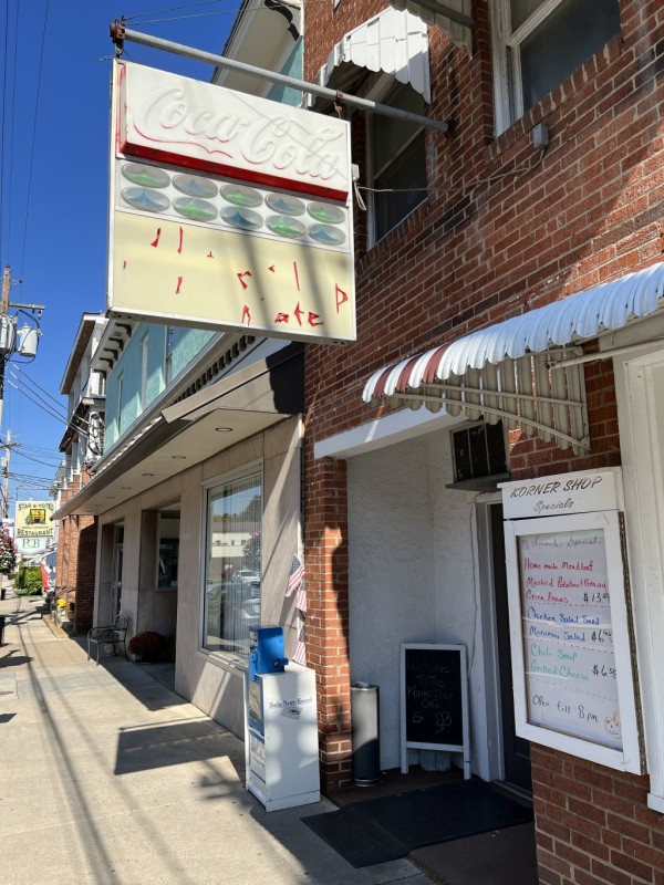 The sign in front of the Korner Cafe had seen better days