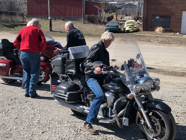 HELPING TO MOVE MICK's &amp; RUTH's BIKES TO SAFE GROUND BEFORE MOUNTING.