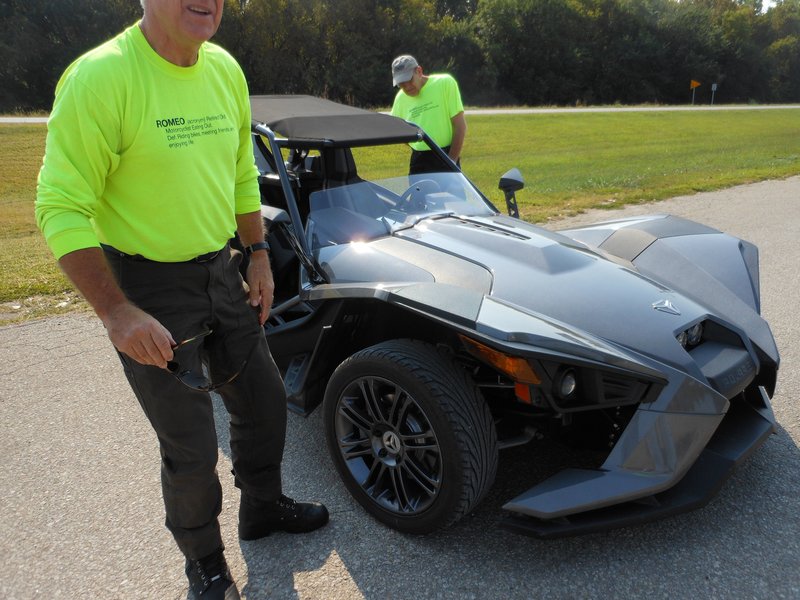 Tom and John are conducting the Slingshot inspection upon arrival.  Alfred made an appearance again, up from St. Mary's.  Notice the after market soft top that he installed this week.