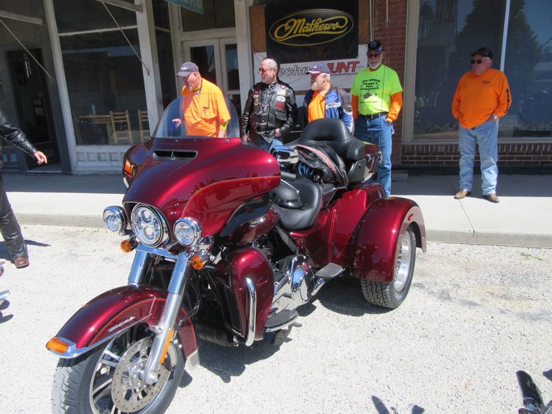 Bill and Linda demonstrating the results of stopping by Worth HD on their way home from Cameron, MO yesterday.  For dessert, they brought home a brand new, gorgeous red HD trike!  And you think that having pie is expensive!!