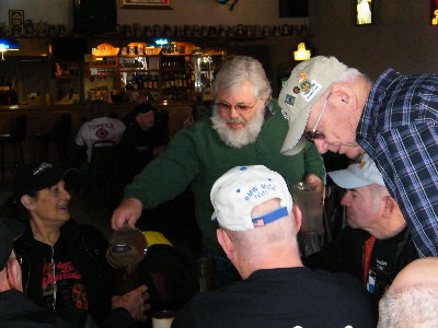 Everybody is watching the waiter of the day????? DON, to make sure that he doesn't spill anything on anybody!!!!!