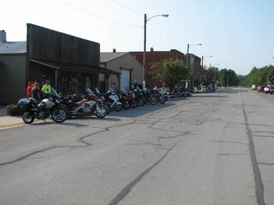 Bikes parked on the dark side of the street