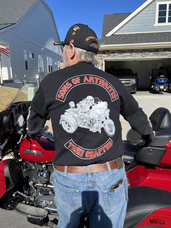 John is very proud of the new shirt his daughter gave hime