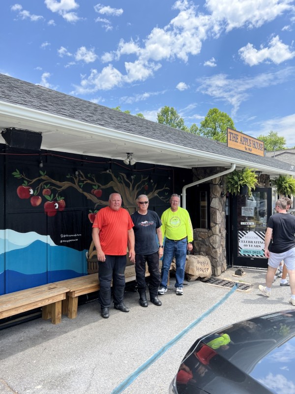 Three sad and dejected motorcycle riders