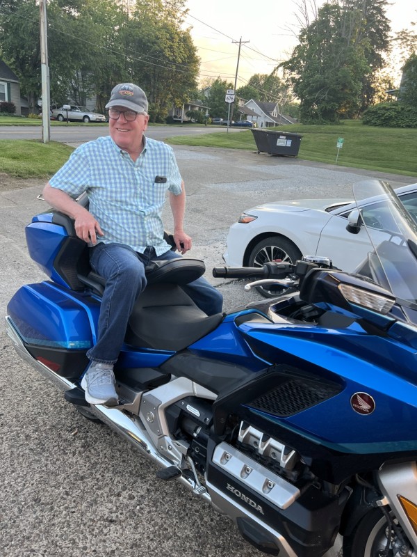 Our fearless leader just can't stay off the back of a Gold Wing