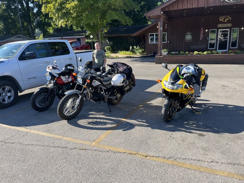 John, Mike and Ed were first on the scene today. John watched the bikes while Mike and Ed took a quick before-breakfast dip in the frigid white river. We told John to watch all three bikes .. but he just stared at his beautiful red Moto Guzzi. We are still looking for Ed and Mike.