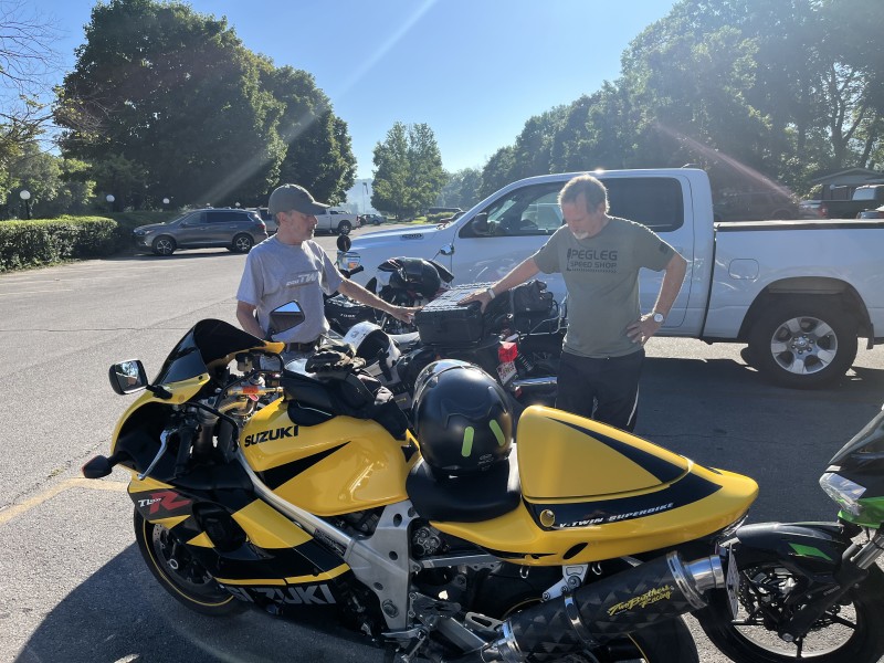 Mike is proud of his new top box. He has the coolest accessories on that TW 200. John likes to bless all our new bike accessories. He said a short prayer blessing the new box.