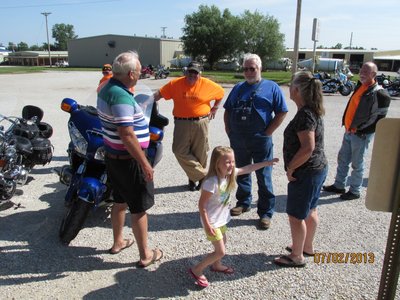 Recruiting a new Romeo, yes she rides on grandpas trike.