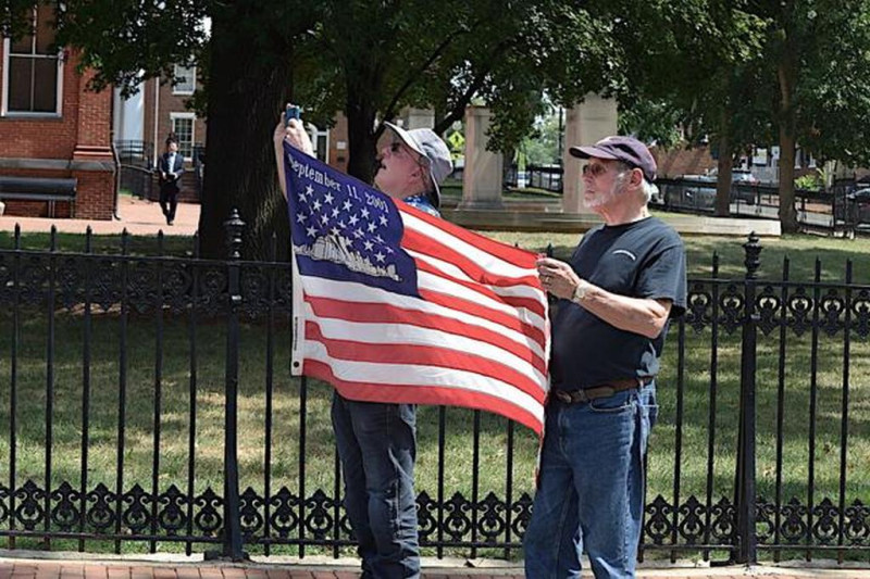 John brought his 911 flag and Brian and he held it up as the procession passed