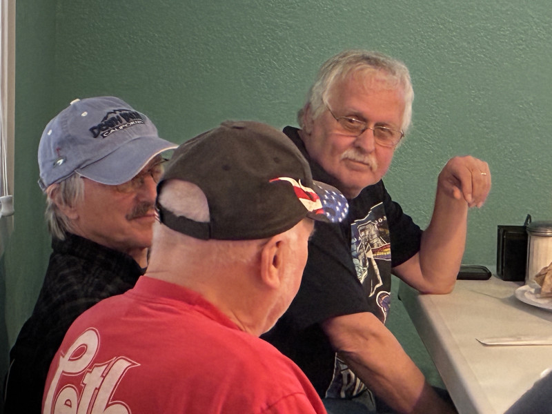 Neil and Bill enjoying a conversation with Leo.